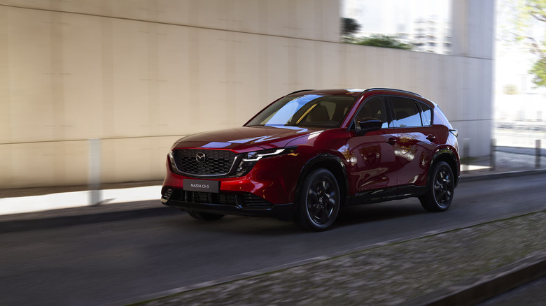 Soul Red Crystal Mazda CX-5 crossover driving.