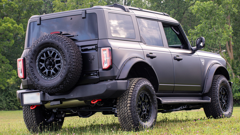 A matte black Ford Bronco with the ORV Package rear 3/4