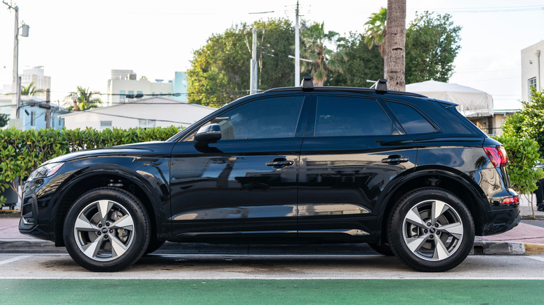 A side view of a black Audi Q7 55