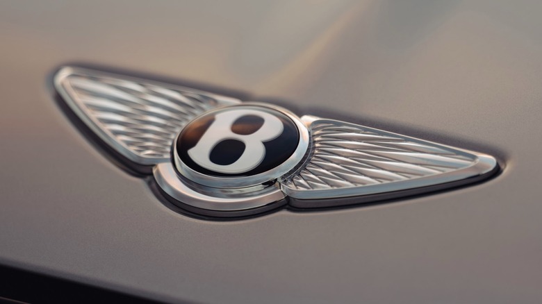 A close-up image of a Bentley badge on the Torcal EV