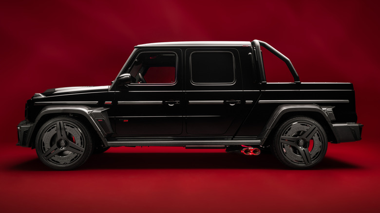 A side profile shot of a black and carbon fiber Brabus P 900 Rocket Edition