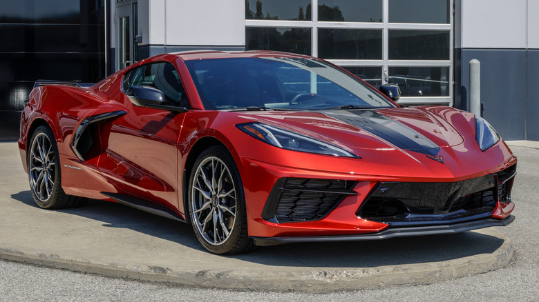 A red Chevrolet Corvette Stingray at a dealership