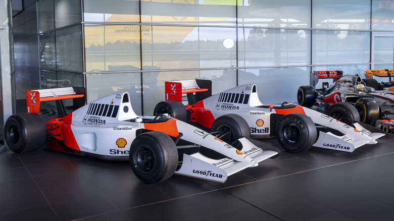 Two 1991 McLaren MP4/6A models lined up at McLaren's facility before being sold