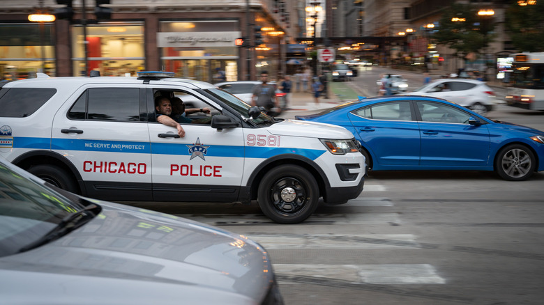 A Chicago police vehicle driving through traffic