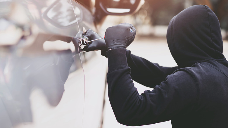 A person breaking into a car