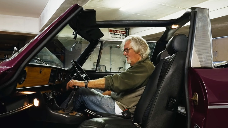 James May sitting inside his 1974 Triumph Stag