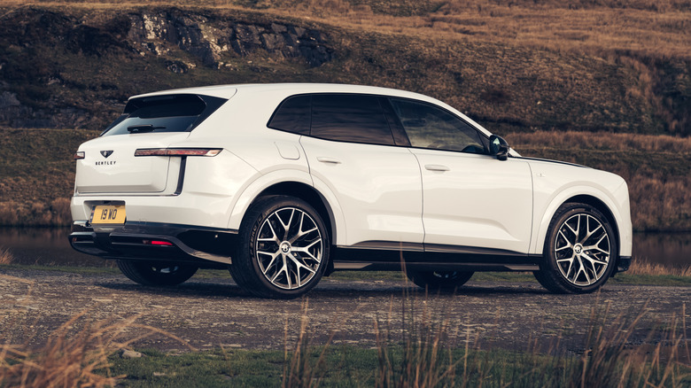 The rear three-quarter of a white Bentley Torcal