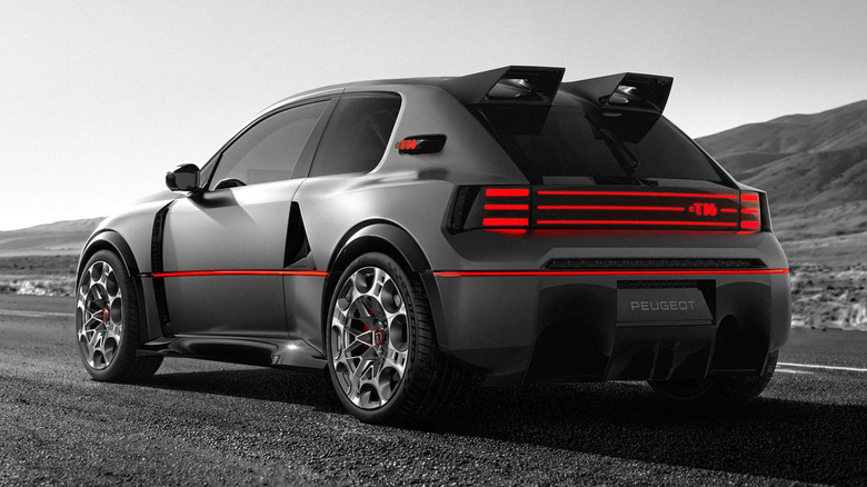 The rear three-quarter of the Peugeot E-T16 Concept parked on the road in front of mountains