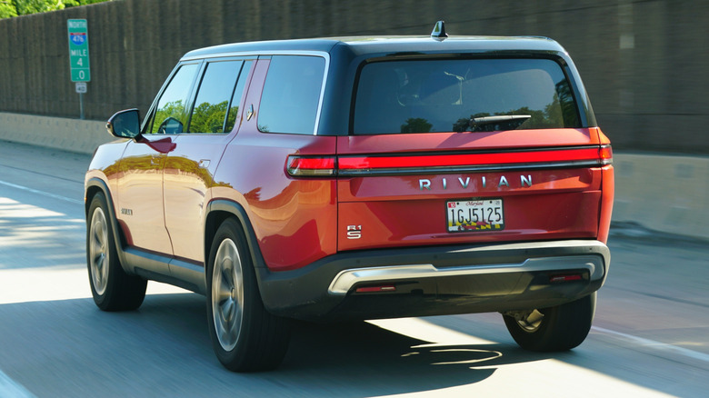 A Rivian R1S driving on the highway