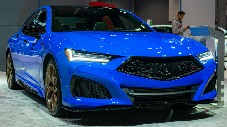A blue Acura TLX Type-S on display at a motorshow