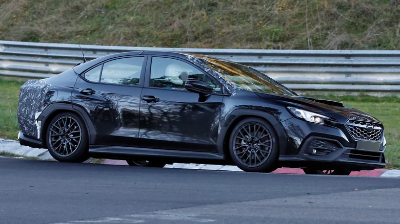 A side view of the all-black Subaru WRX