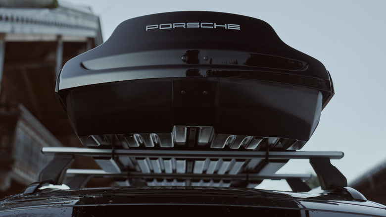 Porsche Roof Transport System with a Roof Box.
