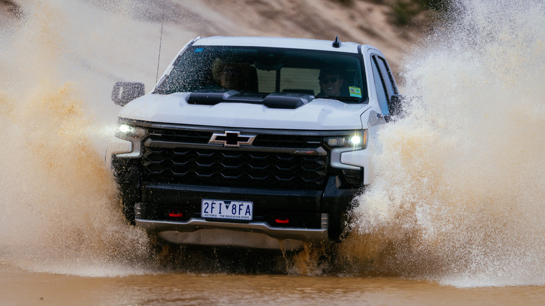 A Chevrolet Silverado ZR2 driving through water