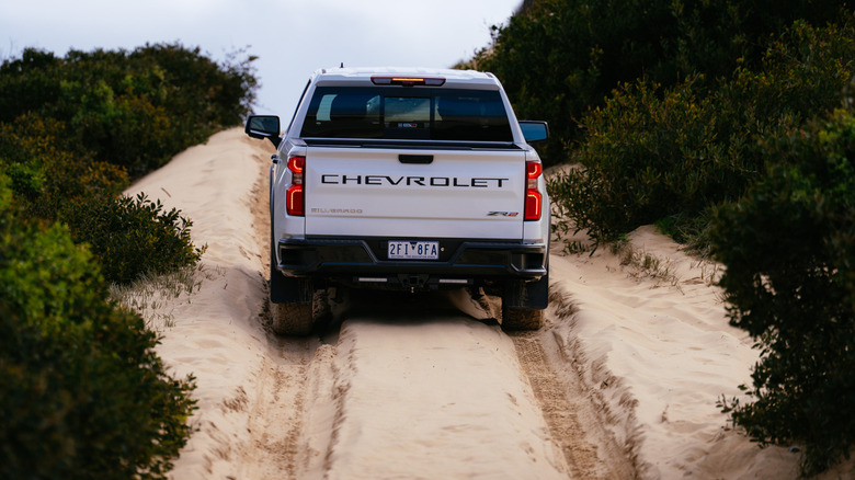 The Chevrolet Silverado ZR2 climbing up a sandy track
