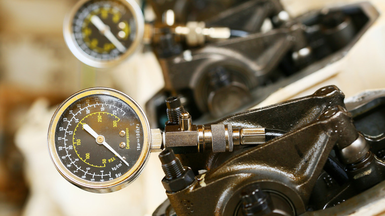 an engine's compression being checked