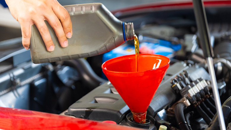 Fresh oil being poured into an engine