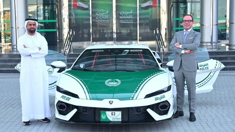Officials posing next to the Lamborghini Temerario with Dubai Police livery.