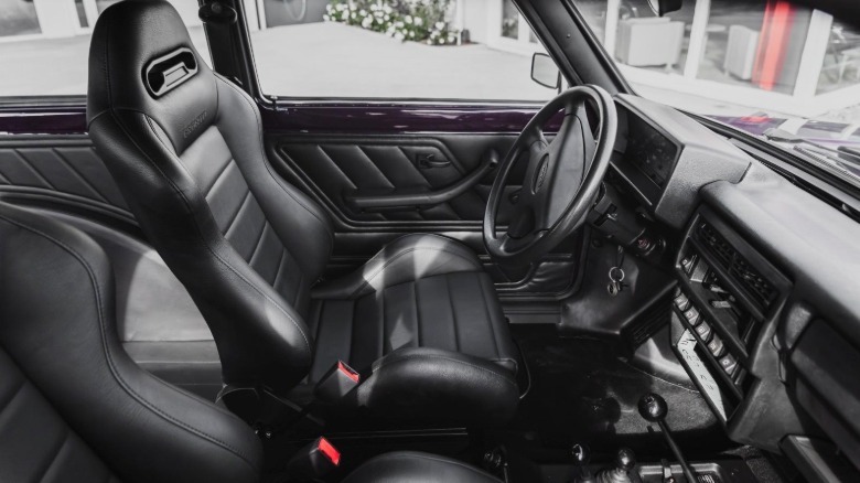 The interior of the Lada Niva Marsh with Bronto lettering on the bucket seats and steering wheel.