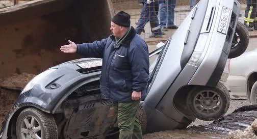  The Mother of All Potholes in Russia takes down Three Cars and a Truck