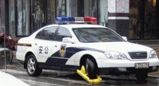  Oh the Irony: Police Car in Beijing gets Booted