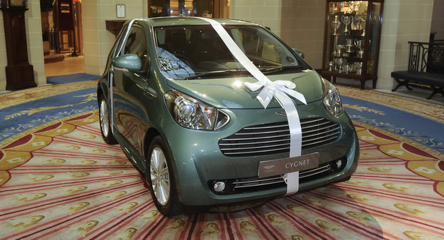  Sir Stirling Moss Buys an Aston Martin Cygnet for his Wife