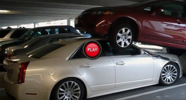  Oops…Honda Civic Driver Flies Onto a Cadillac CTS at a Parking Lot