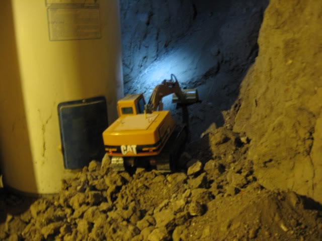 Canadian Digs Out Basement Using Only Radio Controlled Scale Tractors And Trucks