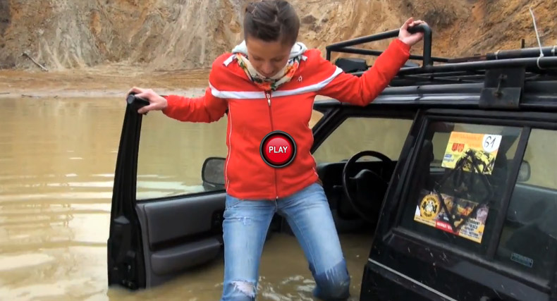  Watch Polish Drivers Try to get a Jeep Cherokee Out of Waist Deep Mud Water