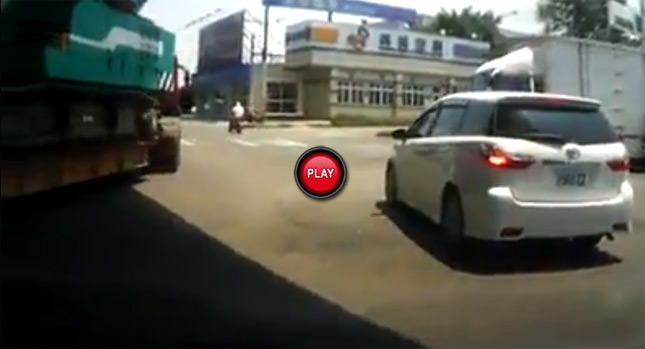  Freaky Accident: Crane Hooks Up Car on the Road and Takes it for a Wild Ride!