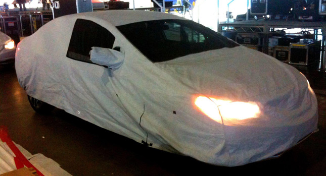  LA Auto Show Organizers Ask What Car is Hiding Under These Covers?