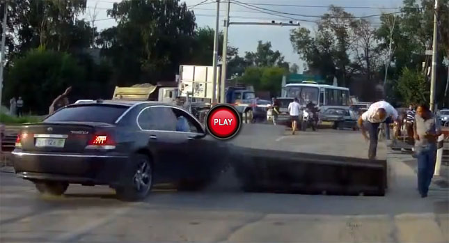  BMW Driver Wedges his 7-Series in a Railway Crossing Barrier