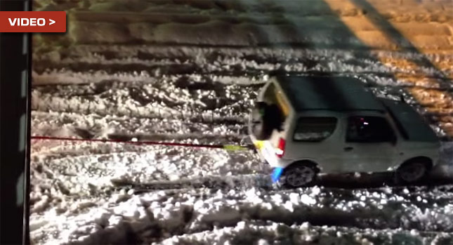  Spirit of the Samurai: Watch Suzuki's Tiny 4×4 with 0.6L Engine Tug a Giant Out of the Snow