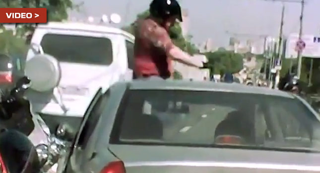  Russian Biker Attacks the Wrong Driver, Pays the Price