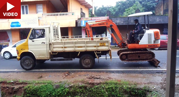  Watch a Small Excavator Load itself onto Truck