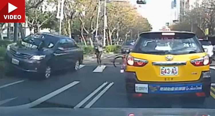  Car Slams Woman’s Bicycle, She Somehow Remains on Her Feet and Walks Away!