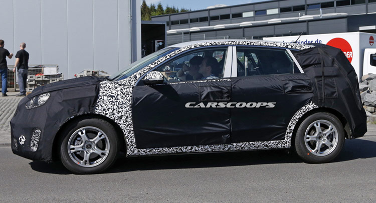  Think You Can Tell Us Which New Kia Model We Spied Here?