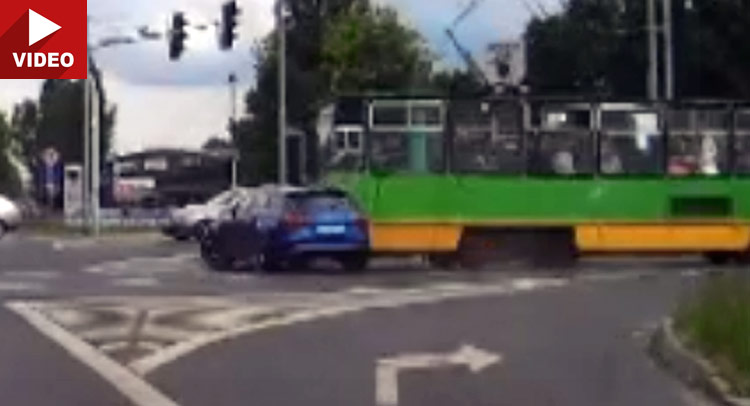  Idiot In Audi RS6 Drifts Past Red Light And Crashes Into A Tram