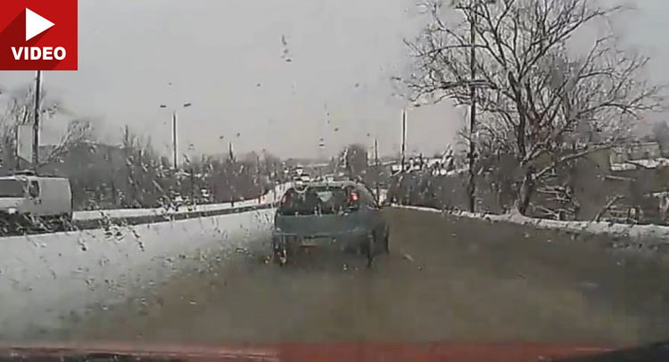 Slush Causes Driver To Lose Control, Car Goes Belly-Up
