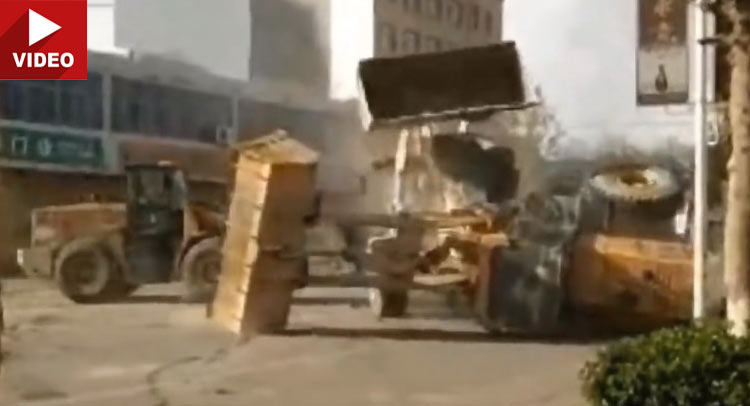 Bulldozers Get Into A Transformers-Style Fight On The Streets Of China