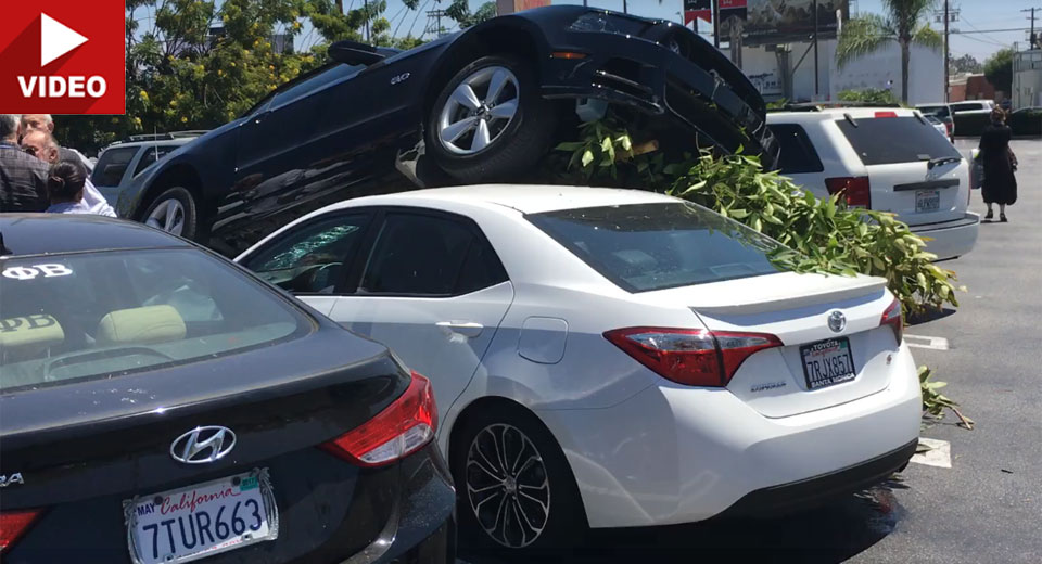  Ford Mustang Crashes In Parking Lot And Lands On Top Of A Corolla