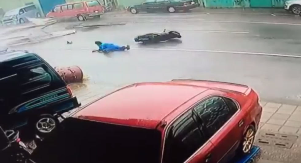 Scooter Rider Gets Hit By Debris Scattered By Typhoon Meranti