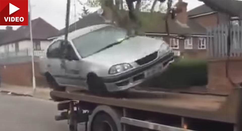 Man Attempts To Drive His Toyota Off A Tow Truck