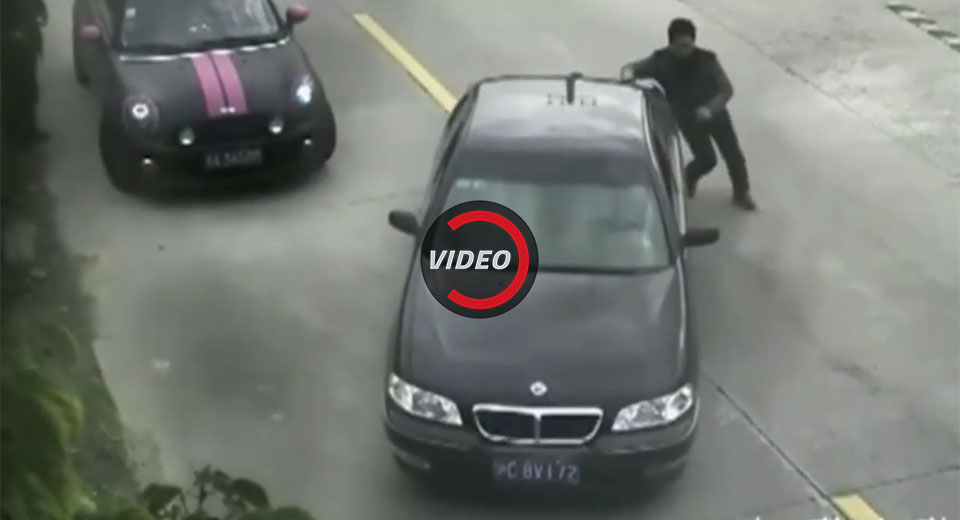 Driver Reverses Into Chinese River While Knocking Down Biker