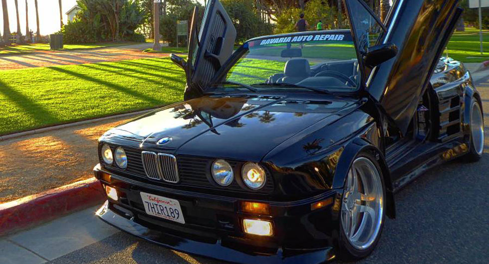  This Fat-Bottom 1989 BMW E30 Has An E36 M3 Engine, Lambo Doors And Testarossa Strakes