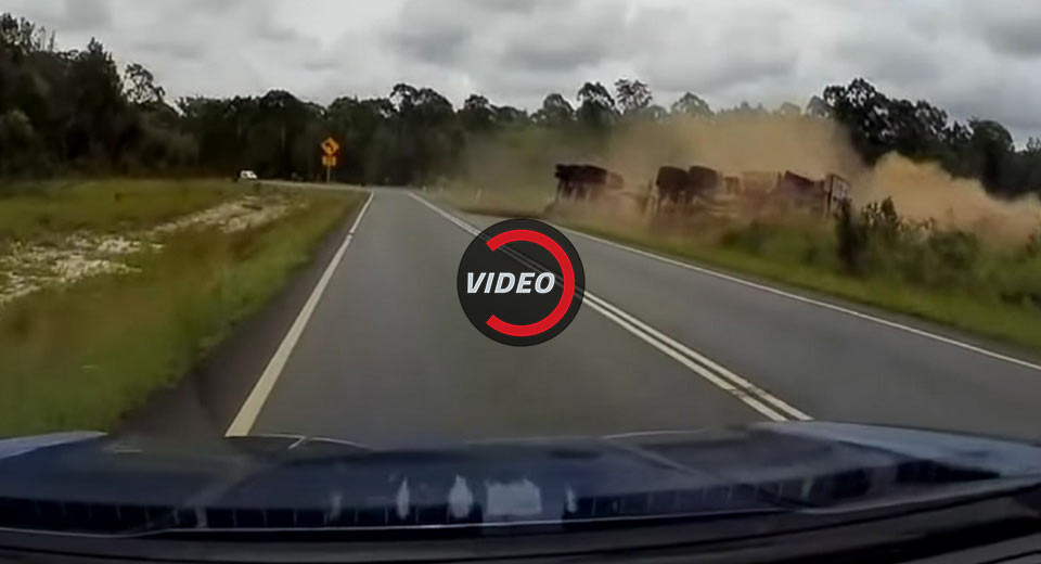 Semi Truck Carrying Logs Rolls Over On Its Side In Australia