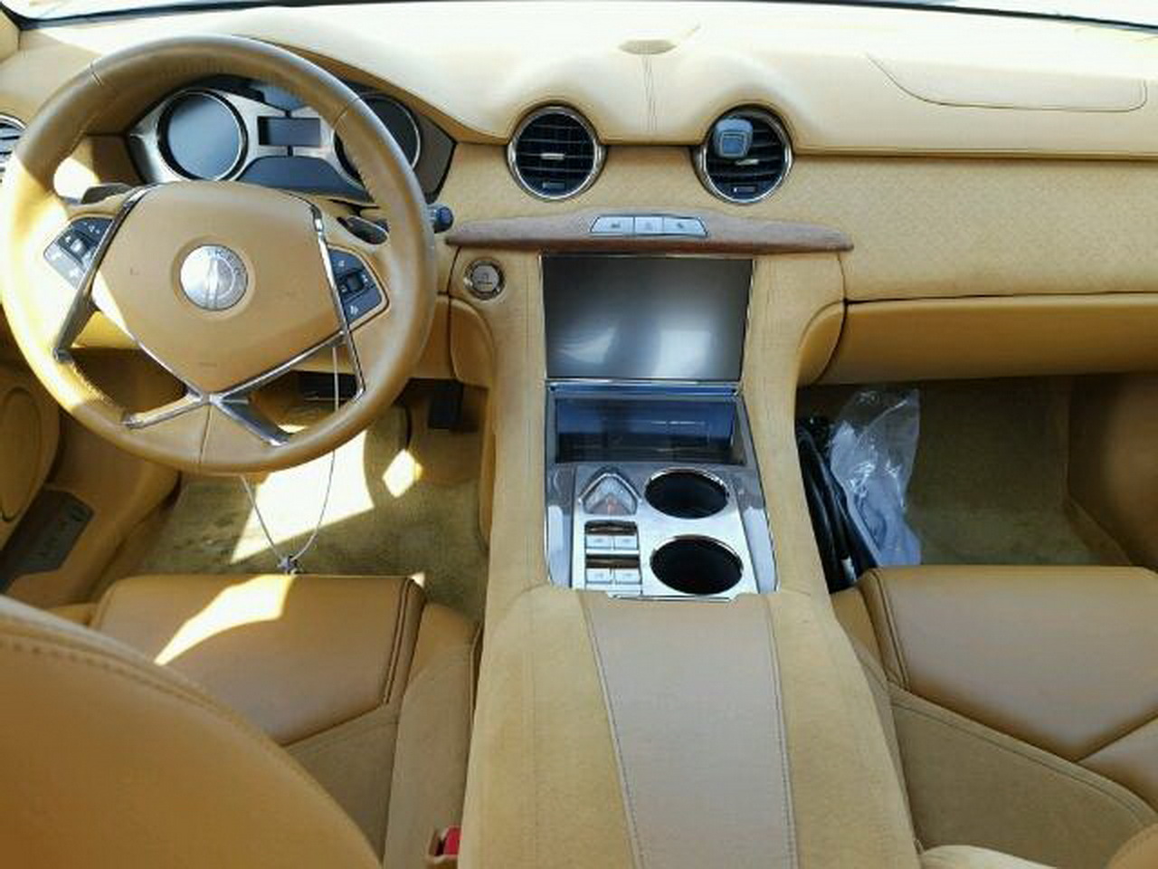 02a07ad4-5f067980-b1d5-4208-933f-de0024d549c8 This Flood-Damaged Fisker Karma Is Just Begging For A V8 Engine Swap