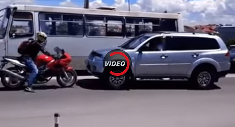  Biker Stands His Ground Over SUV Trying To Skip Traffic