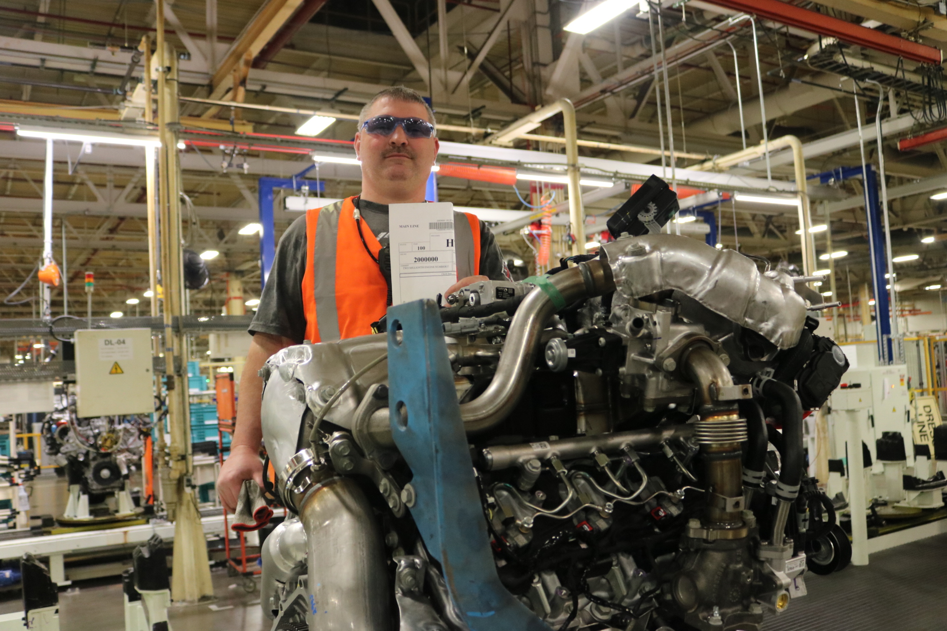 DMAX employee with 2 millionth build request and engine, The New Chevy Silverado’s Duramax Diesel Will Be The Only One Made In The United States