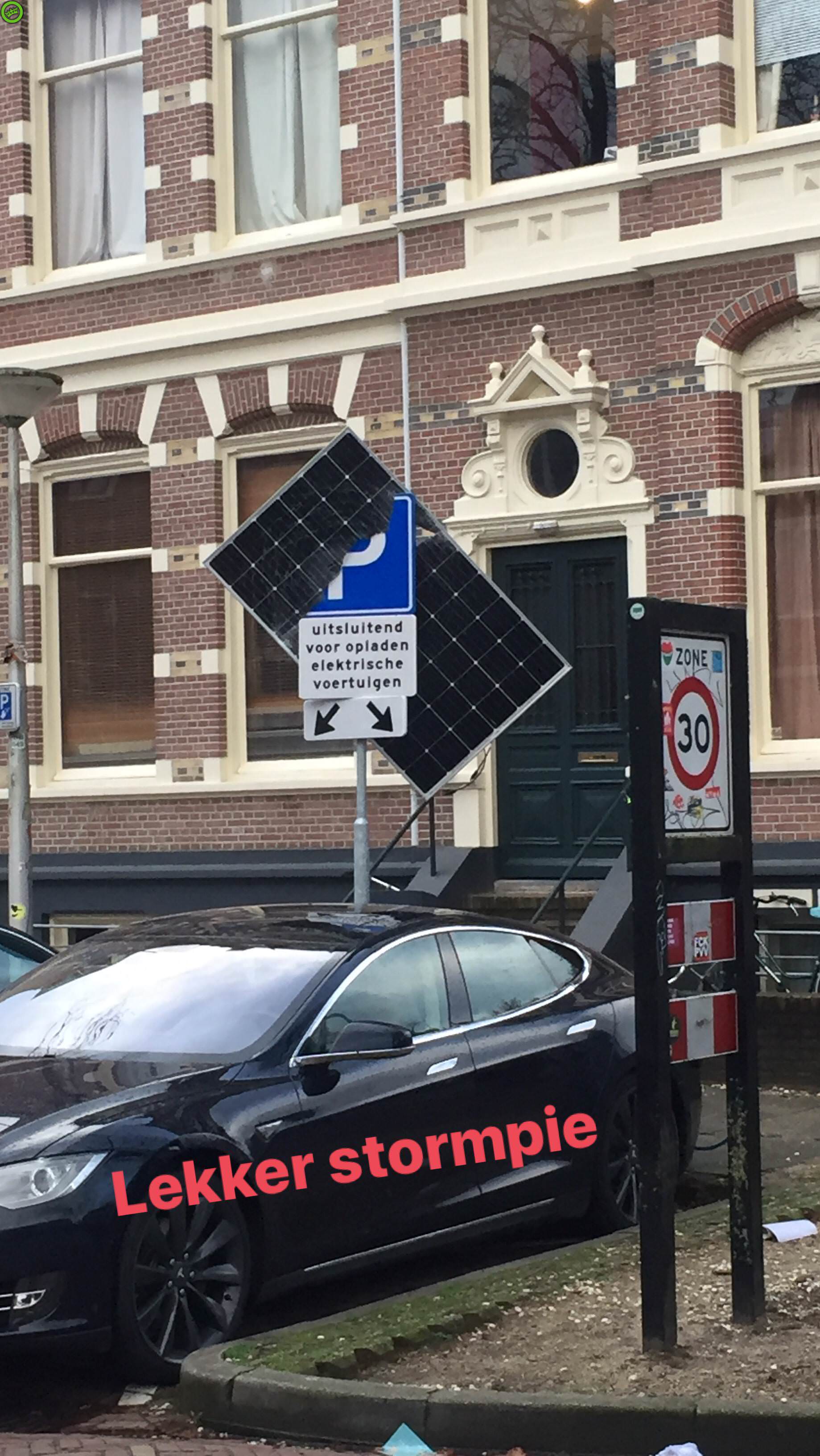 Tesla-Model-S-Solar-Panel-1 Tesla Model S Saved From Falling Solar Panel By Traffic Sign