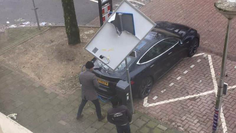 Tesla-Model-S-Solar-Panel-3 Tesla Model S Saved From Falling Solar Panel By Traffic Sign